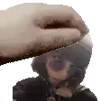 a pixelated image of a woman wearing sunglasses and a hat