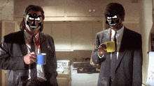 two men in suits drinking coffee in a kitchen with their faces painted