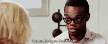 a man with glasses is talking to a woman and saying lies are like tigers they are bad .