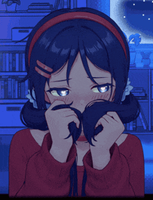 a girl covering her face with her hair with a blue background