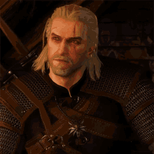 a man with white hair and a beard is wearing armor
