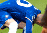 a soccer player in a blue jersey with the number 8 on it