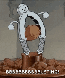 a cartoon character is holding a nutcracker over a bowl of nuts and nuts .