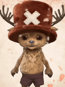 a stuffed animal with antlers and a red hat with an x on it