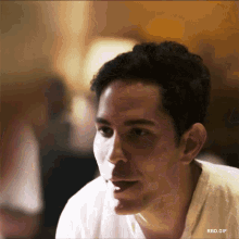 a close up of a man 's face with rbd.gif written below it