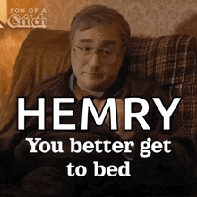 a man is sitting in a chair with the word hemry on it