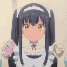 a girl in a maid outfit holds a pink object in her hand