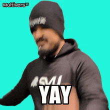 a man wearing a beanie and a hoodie with the word yay on it