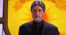 a man with a beard has a red circle on his forehead