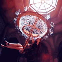 Swinging On The Chandelier Rosé GIF