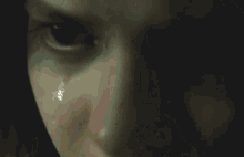 a close up of a woman 's face with a blurred background