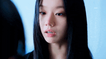 a close up of a woman 's face with her mouth open