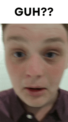 a close up of a man 's face with the words guh written above him