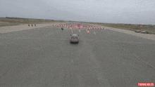 an aerial view of a car driving around a circle with thinkjules written on the bottom