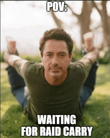a picture of a man laying on the grass with a caption that says pov waiting for raid carry