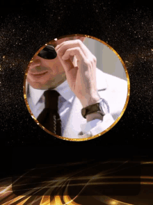 a man in a suit and tie is wearing a watch