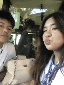 a girl wearing a lanyard that says city science on it