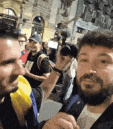 a man taking a picture of another man with a camera