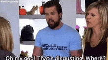 a man and two women are standing next to each other in a store .