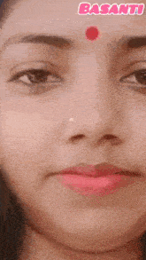 a close up of a woman 's face with the word basanti in the corner
