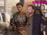 a man in armor is standing in front of a building that says rneys ork