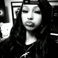 a black and white photo of a woman with the words hoodbyair theyluvoscar at the top