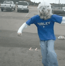 a person wearing a blue hurley shirt is dancing