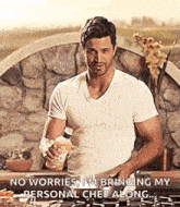 a man in a white shirt is standing in front of a stove and holding a bottle of water .