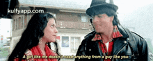 a man and a woman are standing next to each other and the woman says a girl like me