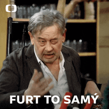a man sitting in a chair with the words furt to samy written below him