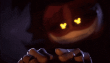 a close up of a person holding a candle in the dark