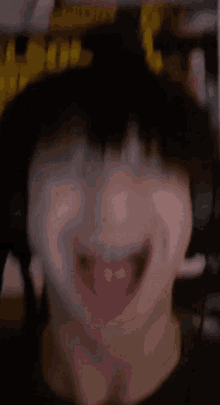 a close up of a man with his mouth open