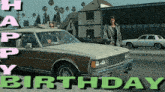 a man stands in front of a car that says happy birthday on it