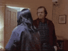 a blurry picture of a man and a woman in a living room