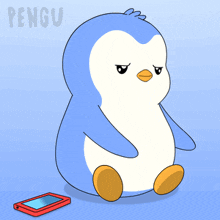 a blue and white penguin is sitting next to a red nintendo ds game
