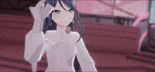a girl with long black hair and blue eyes is wearing a white dress