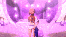 a girl in a bikini is standing in front of a purple heart shaped stage