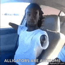 a man with no hands is sitting in the back seat of a car .