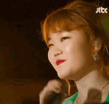 a close up of a woman 's face with jtbc written on the bottom right