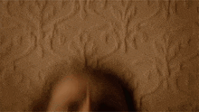 a close up of a woman 's face with her mouth wide open