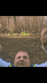 a blurry picture of a man laying on the ground
