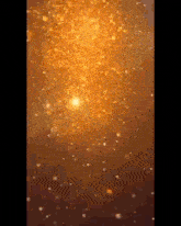 a close up of a candle with a lot of sparkles on it