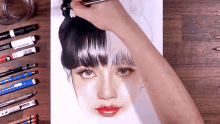a person drawing a woman 's face with a marker that says crayola