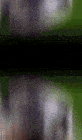 a blurry picture of a person 's face with a black background