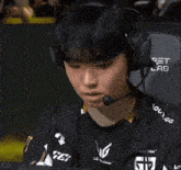 a young man wearing headphones and a shirt that says your
