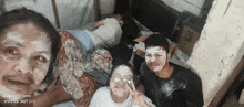 a group of people with their faces covered in white powder and the date of october 27 2014