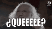 a man with gray hair and a beard is making a funny face and saying `` queeeee '' .