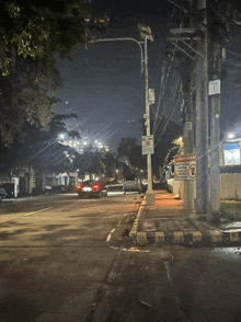 a street with a no parking sign on the pole