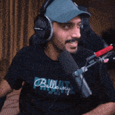 a man wearing headphones and a bullkey t-shirt
