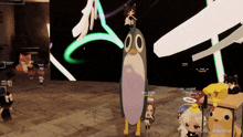 a group of people are playing a video game with a penguin on the floor